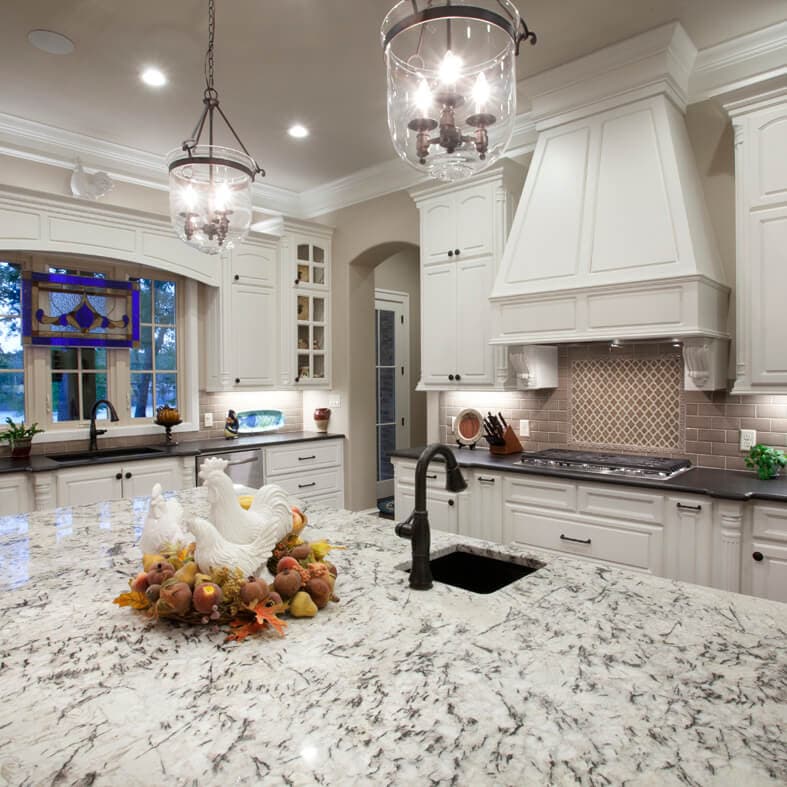 Dark honed stone countertop in a working kitchen