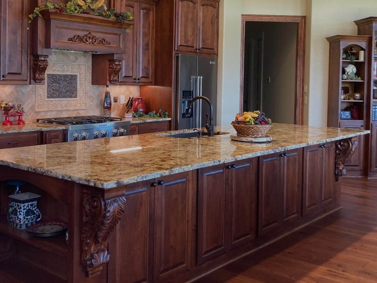 Granite kitchen countertops around white cabinets