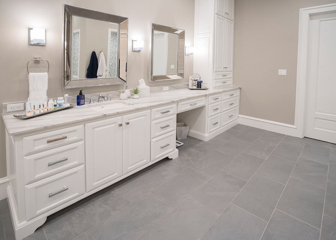 Finished bathroom with large-format gray tile flooring