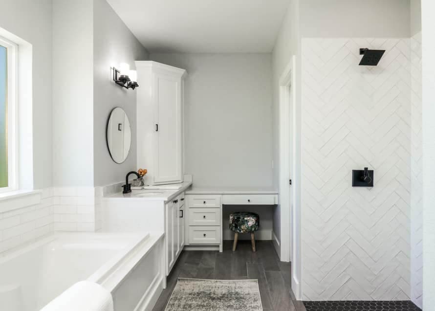 Finished walk-in shower with a white chevron-pattern feature wall